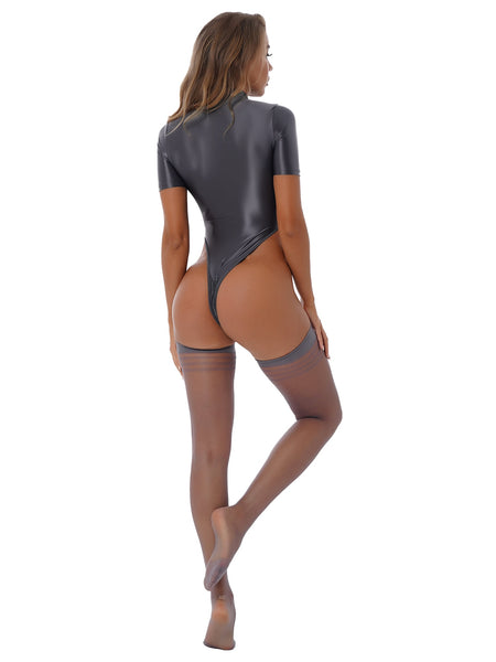 Back view of lady wearing a dark gray glossy short sleeves leotard featuring a front zipper closure, high cut sides and a matching thigh high stockings.