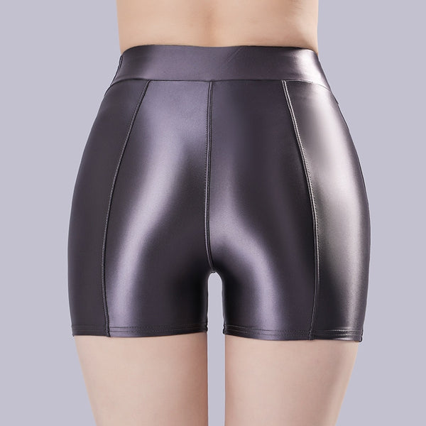 Back view of lady wearing a gray color shorts featuring a wide waistband for all-day comfort and a seductive glossy fabric.