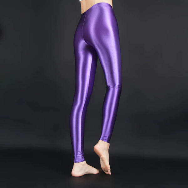 back view of lady wearing purple wet look shiny legging showing off her feet