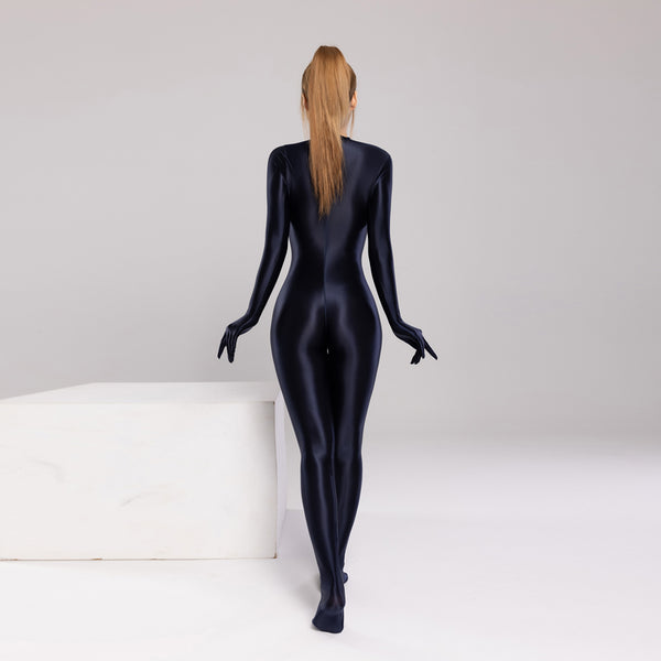 back view of lady wearing midnight blue color wet look catsuit featuring long sleeves, a high neckline, and a back zipper closure.