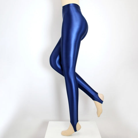 Side view of blue shiny wet look stirrup legging.