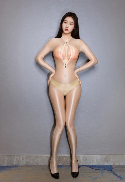 Woman posing in a beige glossy sheer catsuit.