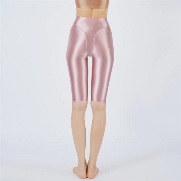 Shiny pink short worn by a person on a white background