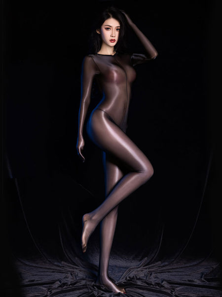 Woman posing in a sheer black glossy bodystocking