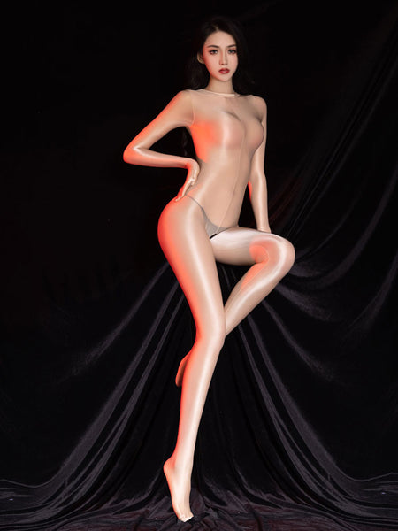 Woman posing in a sheer beige glossy bodystocking