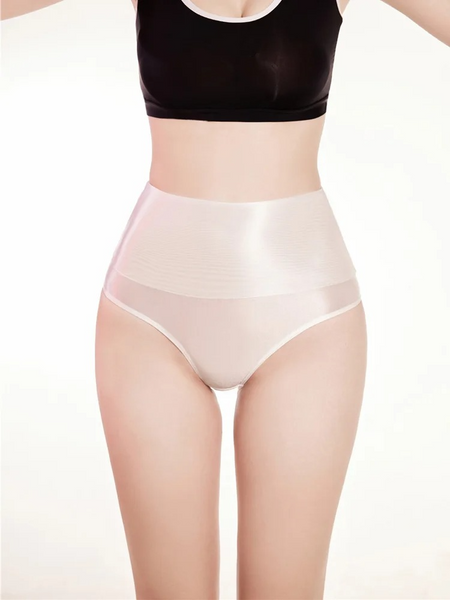 Lady wearing a high waisted white sheer brief.