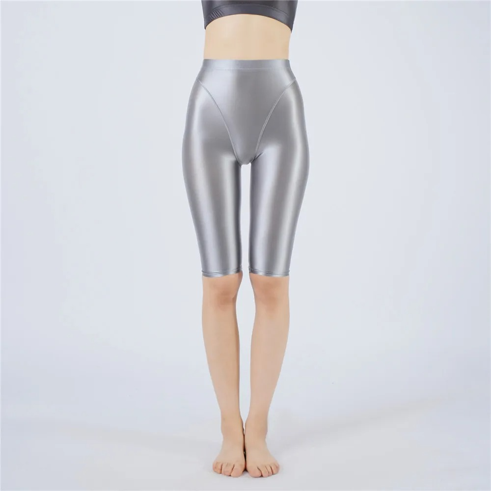 Silver metallic shorts worn by a person on a white background
