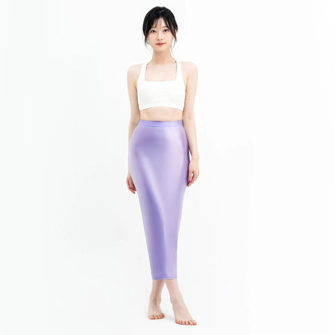 A woman posing in a lavender colored maxi skirt with elastic waistband.
