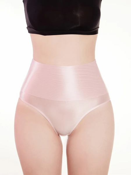Person wearing light pink high-waisted underwear on a white background