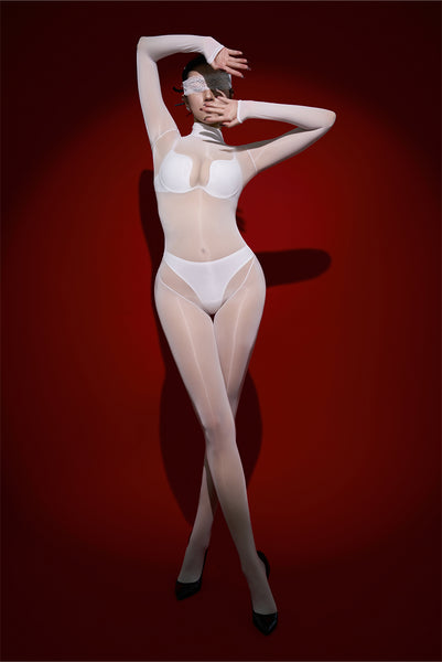 Woman wearing a sheer white bodystocking against a red background