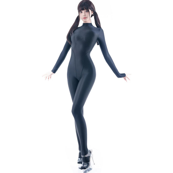 A woman posing in a black glossy catsuit with high heels.