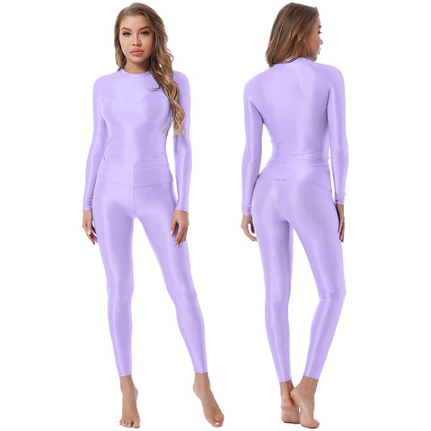 A women wearing a lavender glossy long sleeves spandex top and matching leggings.