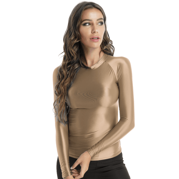 Front view of lady wearing shiny champagne spandex long sleeve shirt.