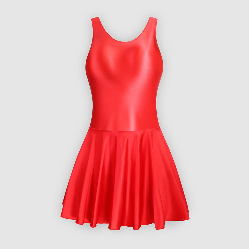 Front view of red leotard dress featuring a scoop neckline, a scoop back cut, thick shoulder straps, and an attached skirt.