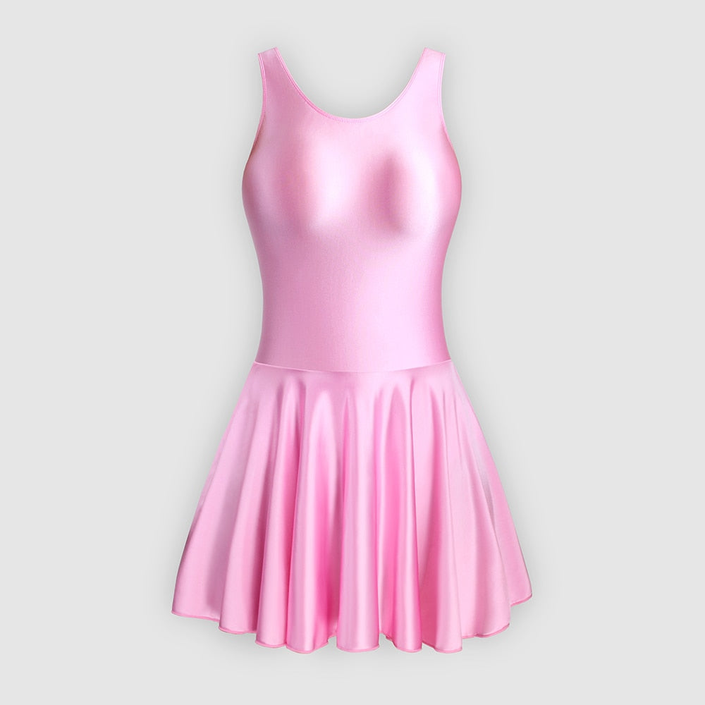 Front view of pink leotard dress featuring a scoop neckline, a scoop back cut, thick shoulder straps, and an attached skirt.