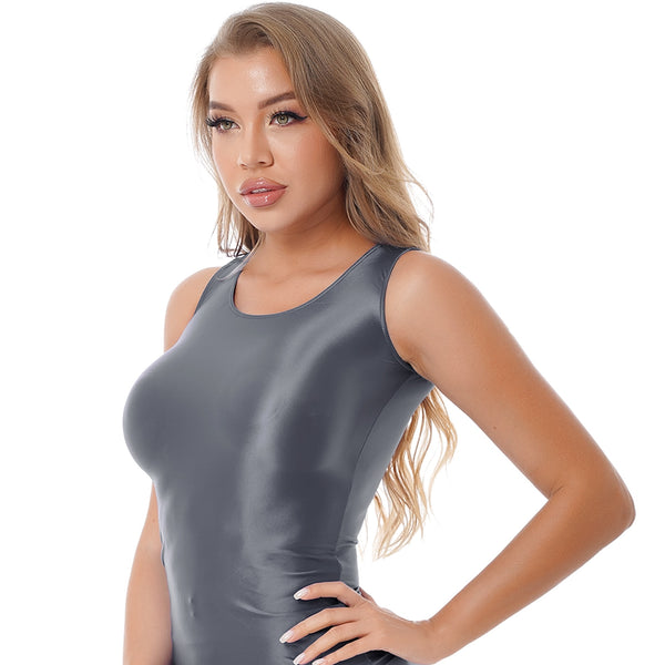 Front view of lady wearing grey tank top featuring a scoop neckline, thick shoulder straps, and a stretchy fabric for all-day comfort.