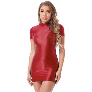 Front view of lady wearing maroon wet look mini dress featuring a high neckline, short sleeves, and seductive glossy fabric. 