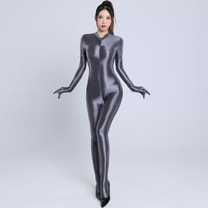 Front view of lady wearing a gray color glossy wet look full-body catsuit with front-to-crotch zipper closure, long sleeves, closed hand, and closed feet with black shiny high heels.