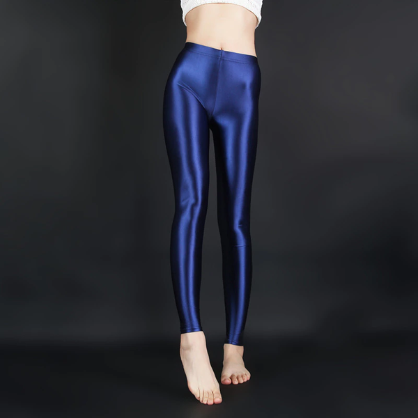front view of lady wearing blue wet look shiny legging showing off her feet