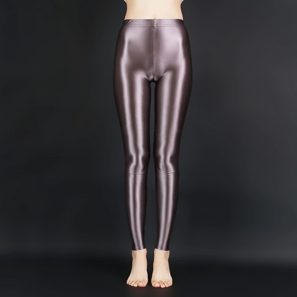 front view of lady wearing brown wet look shiny legging showing off her feet