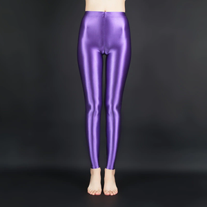 front view of lady wearing purple wet look shiny legging showing off her feet