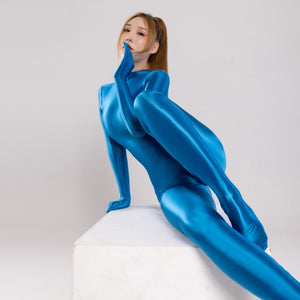 front view of lady wearing azure color wet look catsuit featuring long sleeves, a high neckline, and a back zipper closure.