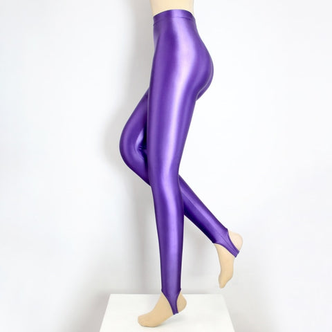 Side view of purple wet look shiny stirrup legging.