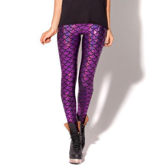 Front view of lady wearing purple shiny legging with shimmering fish scale print.