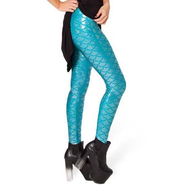 Side view of lady wearing shiny sky blue legging with shimmering fish scale print.