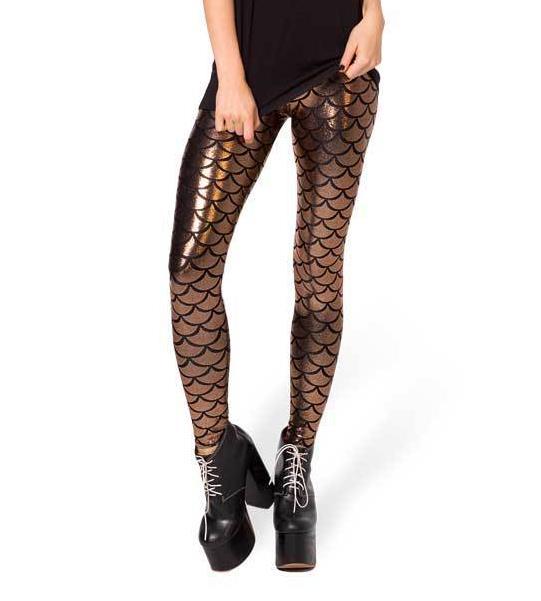 Front view of lady wearing brown shiny mermaid legging featuring fish scale print.