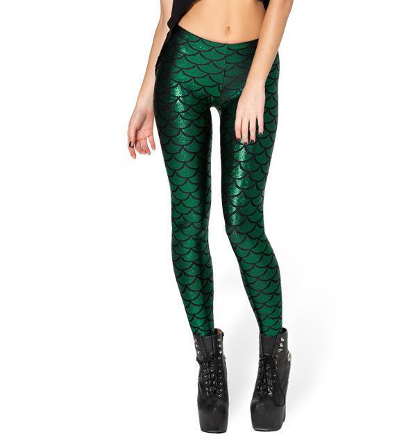 Front view of lady wearing dark green shiny legging with shimmering fish scale print.