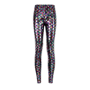 Front view of lady wearing shiny polychromatic legging with shimmering fish scale print.