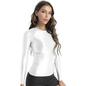 Front view of lady wearing shiny white spandex long sleeve shirt.