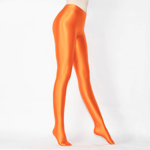 side view of lady wearing orange shiny wet look opaque pantyhose