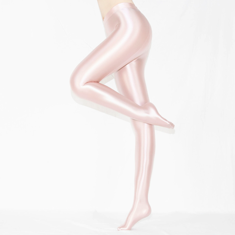 side view of lady wearing pink shiny wet look opaque pantyhose