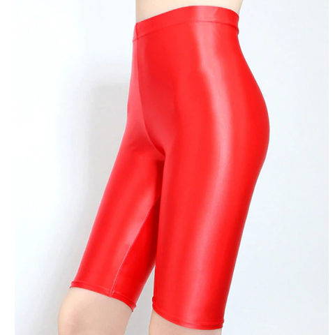 side view of lady wearing red shiny wet look running shorts